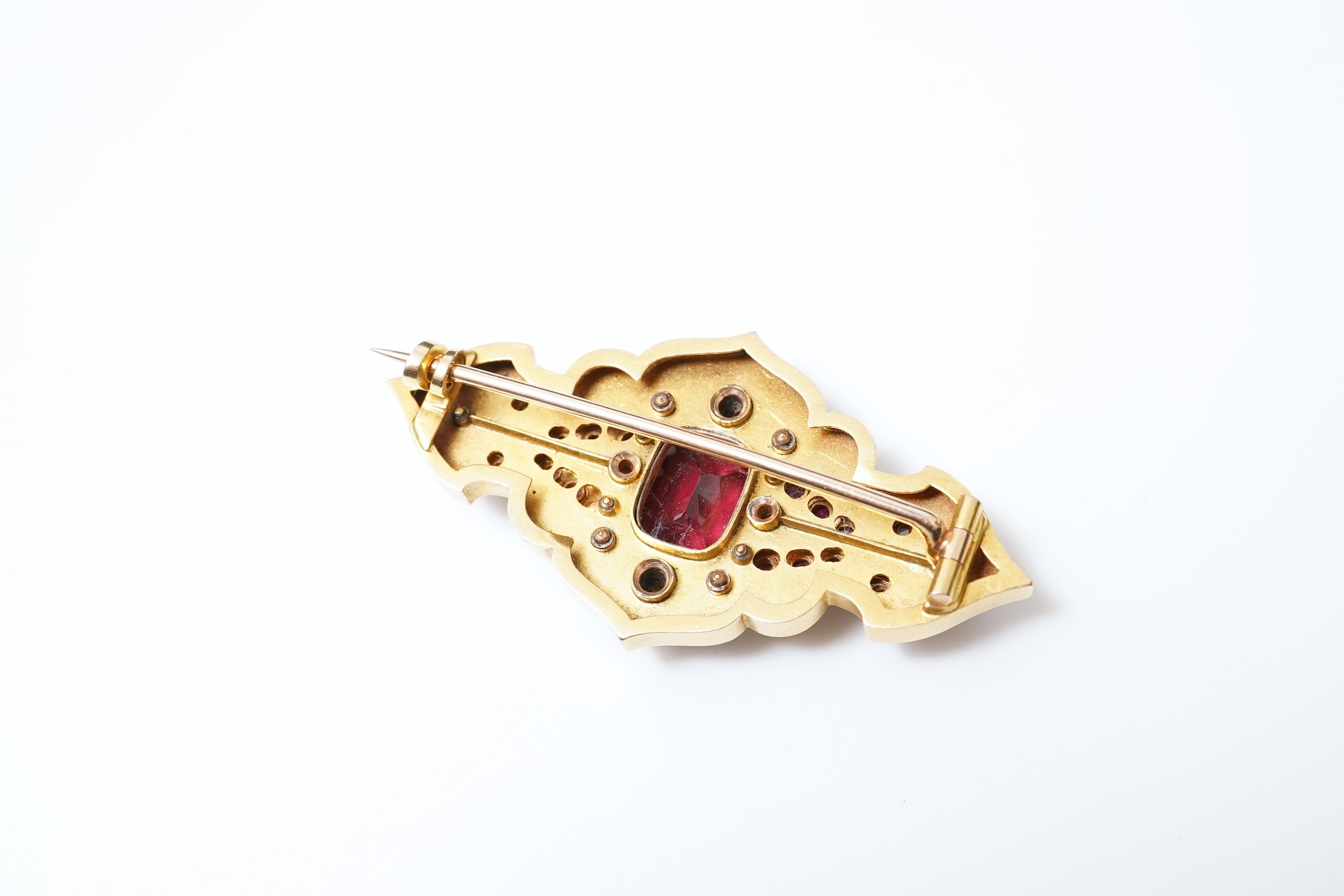 A fine Victorian Renaissance Revival tourmaline, diamond, ruby and enamel brooch, late 19th century